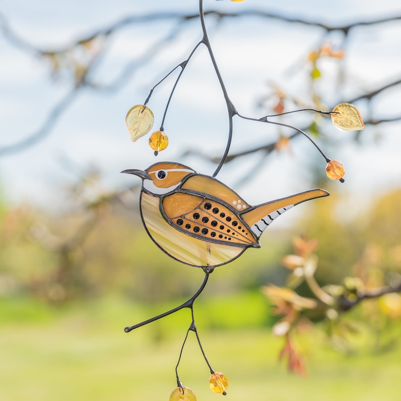 brown bird stained glass window hanging