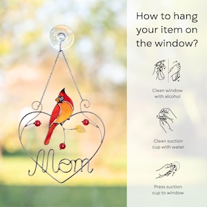 Stained glass cardinal suncatcher product infographic showing how to hang an item on a window correctly.