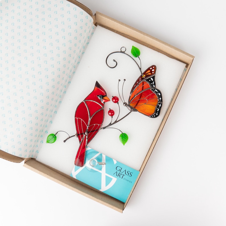 suncatcher of cardinal and monarch butterfly in the brand box of Glass Art Stories