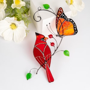 stained glass suncatcher of male cardinal bird and monarch butterfly