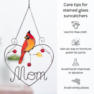 Stained glass cardinal suncatcher care instructions infographic, tips for cleaning and maintaining handmade glass window hanging decor.