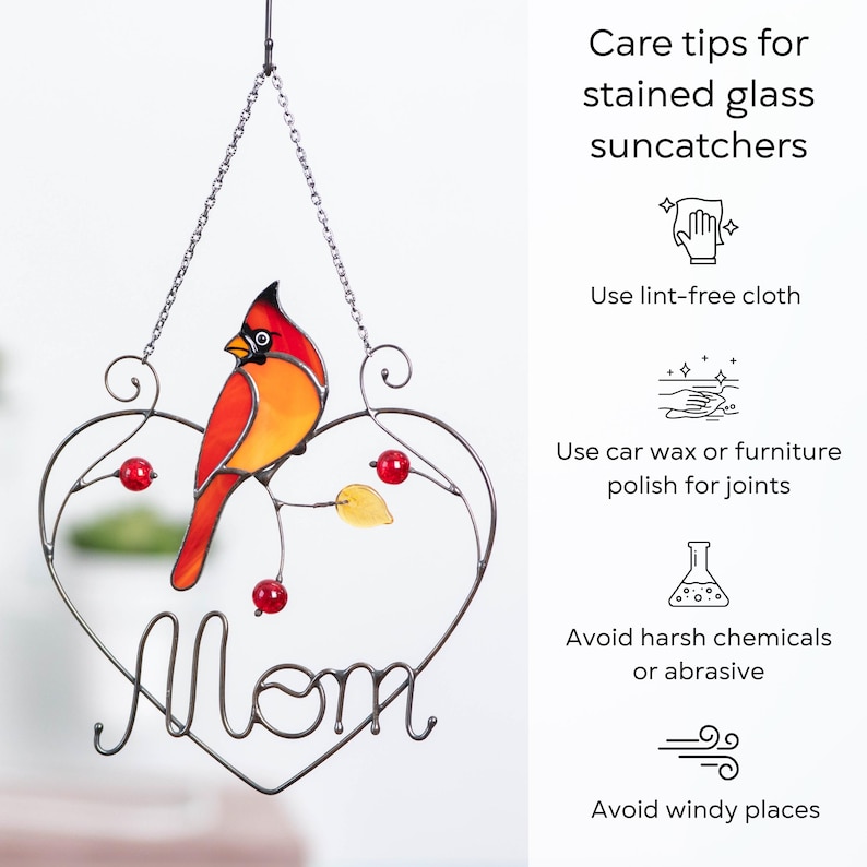Stained glass cardinal suncatcher care instructions infographic, tips for cleaning and maintaining handmade glass window hanging decor.
