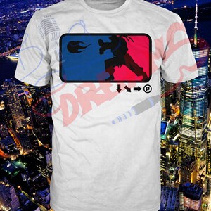 May include: White t-shirt with a blue and red logo featuring a silhouette of a person in a fighting pose. The logo also includes a fireball and the text "P".
