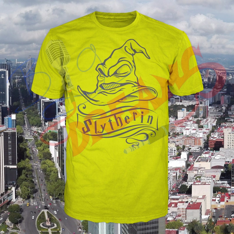 May include: Yellow t-shirt with a black and white graphic of a wizard's hat and the text "Slytherin".