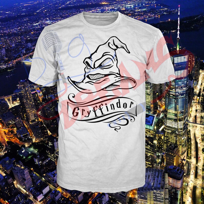 May include: White t-shirt with a black and white illustration of the Sorting Hat from the Harry Potter series. The hat is wearing a frown and the text "Gryffindor" is written on a banner below the hat.