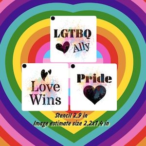 May include: Three white square stencils with black paint splatter and text. The stencils are 2.9 inches in size. The top stencil says "LGBTQ Ally" with a heart. The middle stencil says "Love Wins" with two hearts. The bottom stencil says "Pride" with a heart.
