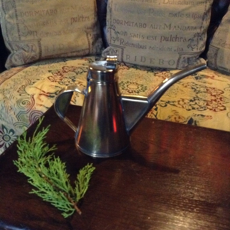 A beautiful vintage antique French brass olive oil vinegar jug.