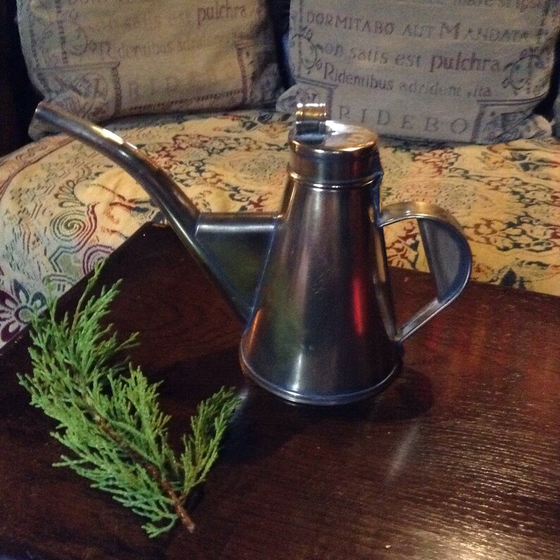 A beautiful vintage antique French brass olive oil vinegar jug.