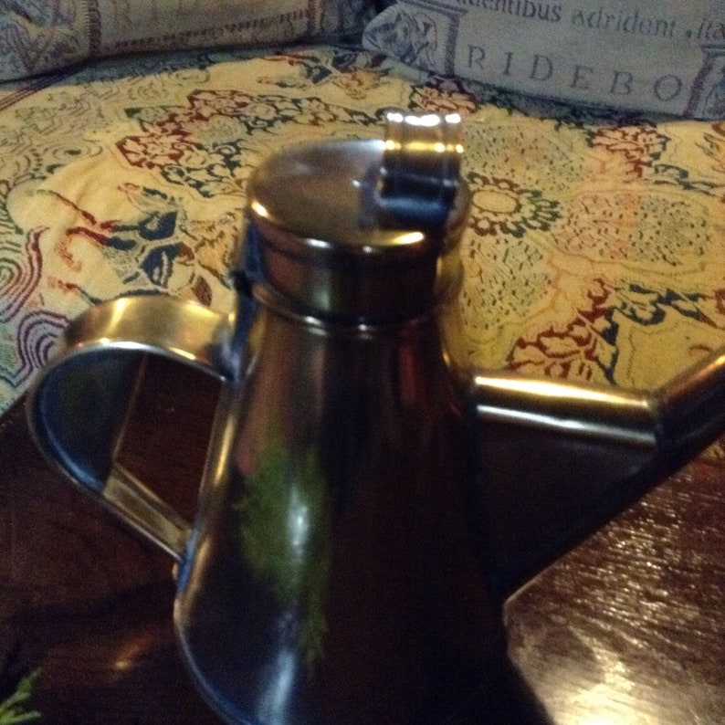 A beautiful vintage antique French brass olive oil vinegar jug.
