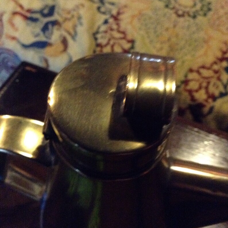 A beautiful vintage antique French brass olive oil vinegar jug.