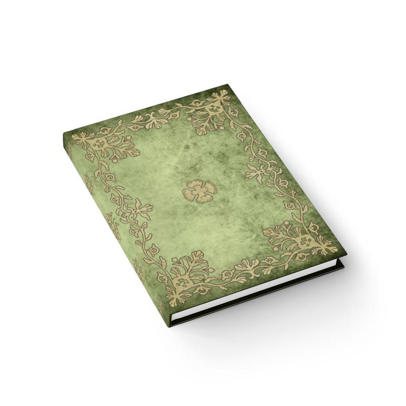 May include: A green journal with a gold floral design on the cover. The journal has a textured, aged look.