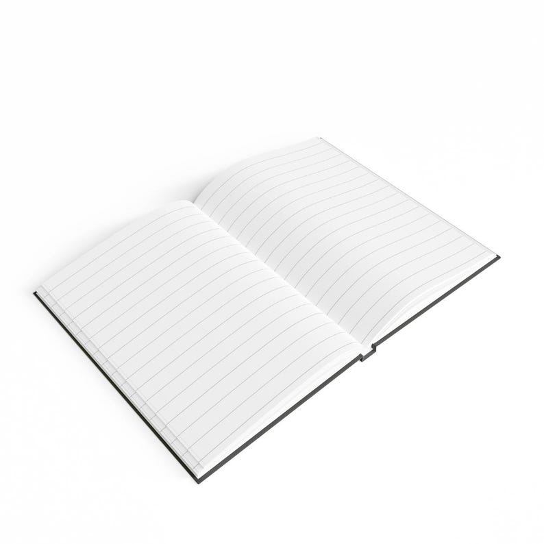 May include: An open lined notebook with a black cover. The notebook is lying flat on a white surface.