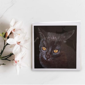 Sleek Black Cat with Amber Eyes Greeting Card. Blank inside.