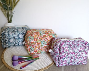 Toiletry bag and basket, adult and baby.