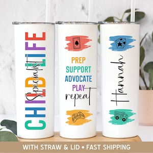 May include: Three white tumblers with colorful designs and text. The first tumbler says "Child Life Specialist" in rainbow colors. The second tumbler says "Prep Support Advocate Play Repeat" in black text with a game controller icon. The third tumbler says "Hannah" in black text with a blue and green watercolor background and a toy truck icon.