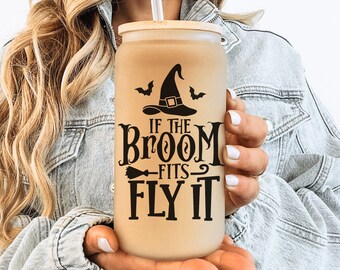May include: A brown tumbler with a black witch hat and the text "If the broom fits fly it".