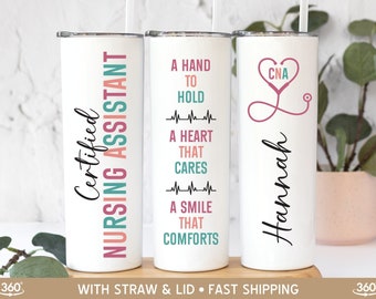 May include: White stainless steel tumbler with a straw and lid. The tumbler features the text "Certified Nursing Assistant" in pink and teal. Another tumbler has the text "A hand to hold, a heart that cares, a smile that comforts". The third tumbler has a stethoscope heart and the name "Hannah".