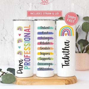 May include: Three white tumblers with rainbow designs and personalized names. The tumblers feature the words "Para", "Professional", "Patient", "Kind", "Loving", "Reliable", "Creative", "Inspires", "Supports", "Encourages", "Advocates", and "Tabitha".