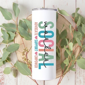 May include: White tumbler with the words "SOCIAL WORKER" in colorful letters. The words "ADVOCATE", "SUPPORT", and "EMPOWER" are written vertically on the side of the tumbler.