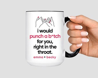 May include: White ceramic mug with a black handle and rim. The mug features the text "i would punch a b*tch for you, right in the throat." in black and pink, with "emma + becky" below. The image also shows a pinky promise graphic.
