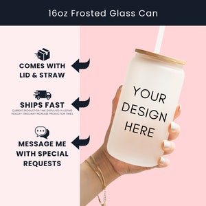a hand holding a white coffee cup with a straw