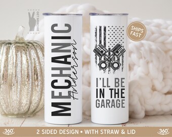 May include: White stainless steel tumbler with a black and gray design that says "MECHANIC Anderson" on one side and a black and white American flag with crossed pistons and the text "I'LL BE IN THE GARAGE" on the other side.