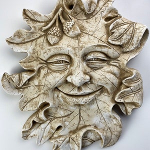 Green Man Sculpture Smiling Leaf Face with Acorns