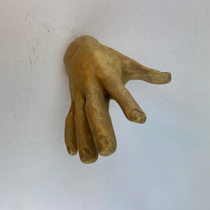Golden Hand Wall Hanging