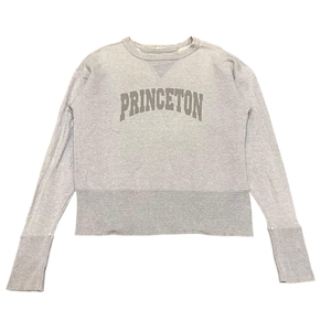 May include: A light gray sweatshirt with the word "PRINCETON" printed across the chest in a darker gray. The long sleeves have wide cuffs, and the bottom hem is a darker shade of gray.