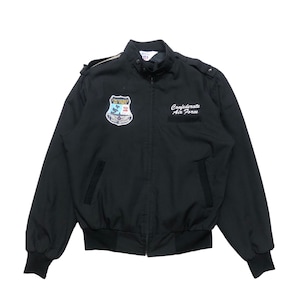 May include: Black bomber jacket with a stand-up collar, shoulder epaulets, and a full-length zip. Features a patch on the chest with the text "Confederate Air Force" and a shield-shaped emblem. Ribbed cuffs and hem complete the design.