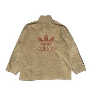 May include: A brown fleece zip-up jacket with a large embroidered Adidas logo on the back. The logo is in a red and white color scheme.