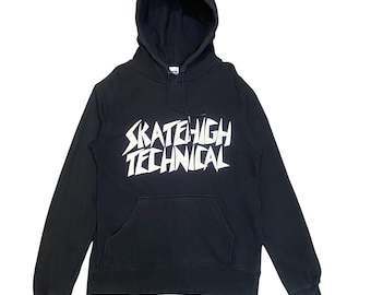 May include: Black hooded sweatshirt with the text "SKATEHIGH TECHNICAL" in white block letters across the chest. The sweatshirt has a kangaroo pocket and a drawstring hood. The garment is made of a soft material.