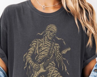 Mummy Rocker Playing Electric Guitar T-Shirt | Skeleton Musician Line Art