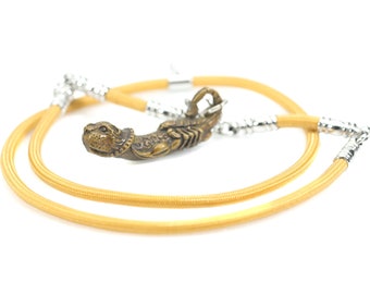 Thai Palad Khik Amulet: Brass Tiger Scorpion King Talisman