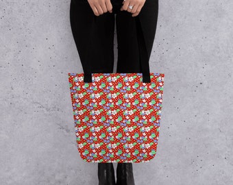 Red tote bag with white and blue flowers. 15x15 foldaway carryall with strong handles for over the shoulder carrying.