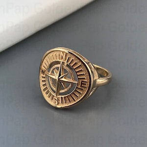 Bague en or massif 14 carats avec boussole