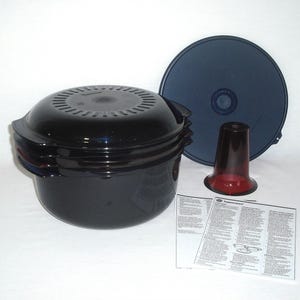 May include: A black and blue cooking pot set with a lid, a red and clear funnel-shaped piece, and a dark blue lid. Includes a printed instruction sheet. Kitchenware.