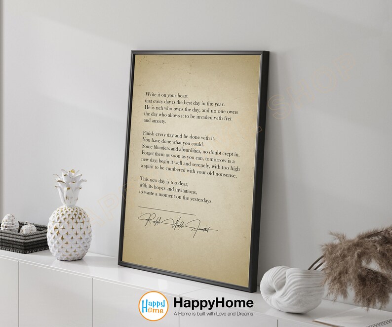 May include: A black framed print with a vintage-style background featuring a quote about making the most of each day. The quote is attributed to Ralph Waldo Emerson. The print is perfect for a home office or living room.