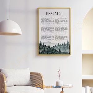 May include: A framed wall art print featuring the text "PSALM 91" in black font. The artwork includes a watercolor image of a forest scene in shades of green and gray. The frame is gold.