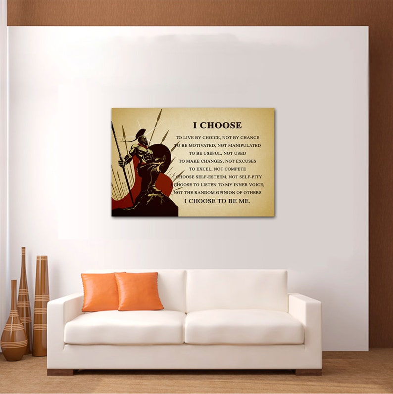 May include: A motivational quote about making choices, "I CHOOSE to live by choice, not by chance... I CHOOSE to be me."  The quote is printed on a canvas with a warrior holding a spear and shield in front of a red and brown background.