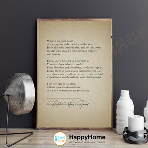 May include: A beige printable wall art poster with a quote about living in the present moment. The quote is attributed to Ralph Waldo Emerson. The poster has a vintage aesthetic and features a handwritten signature.