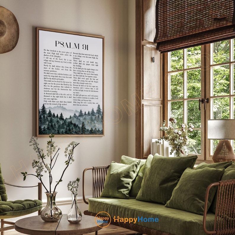 May include: A framed print of Psalm 91, featuring text and a watercolor image of a forest. The print is displayed in a living room with green furniture and a wooden coffee table. The room has a natural, earthy aesthetic.