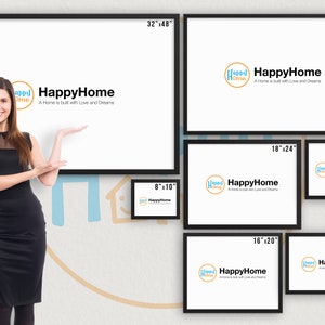 May include: A woman stands in front of a wall with different sized black frames. Each frame has a white background with the text "HappyHome" and a logo of a house with the words "HappyHome" inside. The frames are labeled with their dimensions in inches.