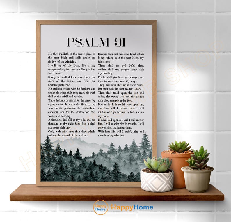May include: A framed print of Psalm 91, featuring the text in a classic font. The bottom of the print displays a serene forest scene in shades of gray and green. The print is displayed on a wooden shelf with three potted succulents.