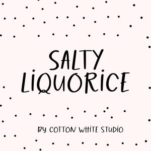 May include: A white background with black dots scattered across the surface. The text "SALTY LIQUORICE" is written in black cursive font. Below the text is the phrase "By COTTON WHITE STUDIO" in smaller black font.