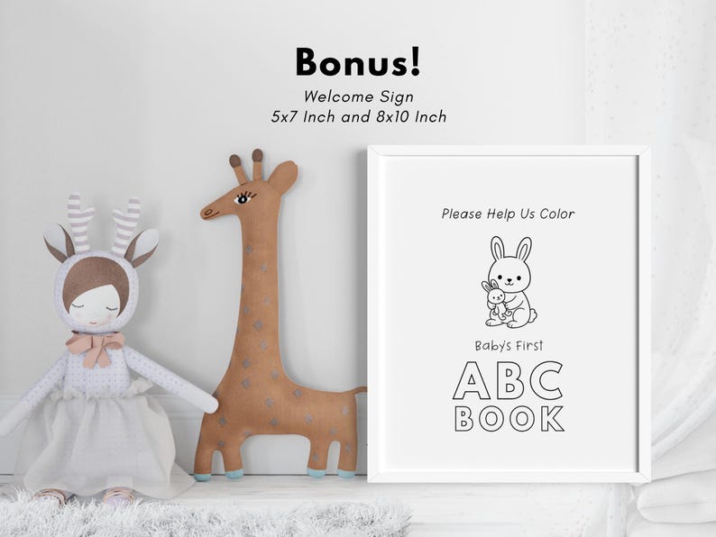 May include: A black and white printable sign with the text "Please Help Us Color Baby's First ABC BOOK". The sign features a cartoon bunny holding a smaller bunny. The sign is framed in a white frame.