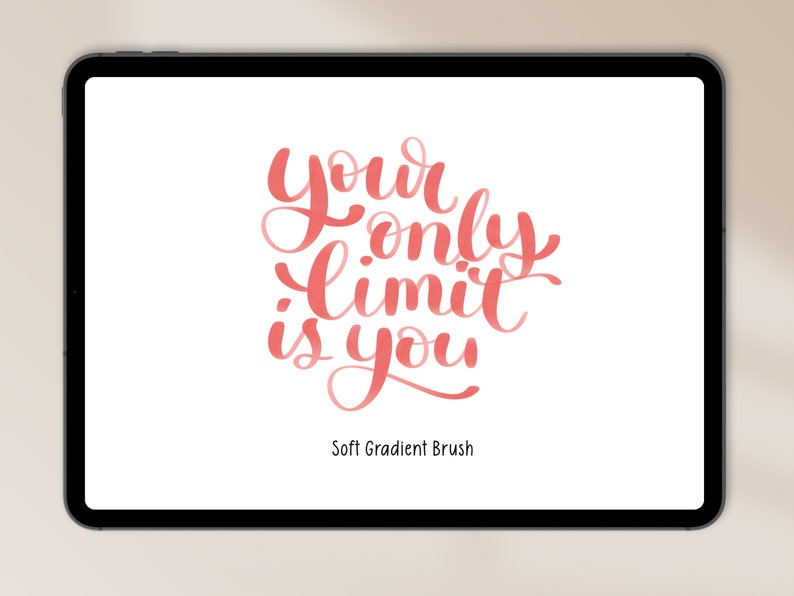 以下が含まれることがあります： デジタルタブレットの画面に、ソフトピンクのグラデーションブラシフォントで「Your only limit is you」というテキストが表示されています。テキストは白い背景の中央に配置されています。「Soft Gradient Brush」というテキストがテキストの下に表示されています。