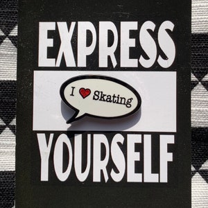 May include: A black and white graphic with the words "EXPRESS YOURSELF" in white. A pin that says "I ❤️ Skating" is in the centre. The pin is a white speech bubble with a red heart.