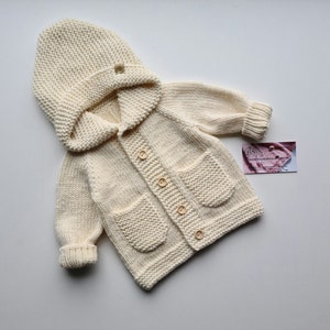 Merino wool sweater
Sweater with hood
Cardigan with buttons
Newborn gift
Comming home outfit
Outside wearing
Baby clothes
Knitted clothes
Toddler jumper
Nice clothes
Beige cardigan
Nice cardigan
Unisex clothes
