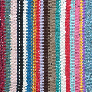 May include: A close-up of a colorful woven rug with stripes of pink, red, blue, green, yellow, and white.